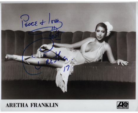 FRANKLIN ARETHA: (1942-2018) American Singer. Signed 10 x 8 photograph of Franklin lying in a full length pose on a large sof