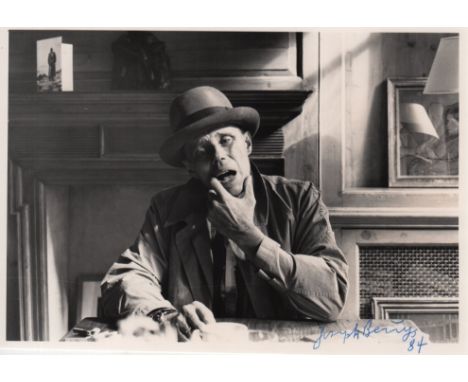 BEUYS JOSEPH: (1921-1986) German Artist. A good signed 8 x 6 photograph of the artist in a half length pose seated at a table