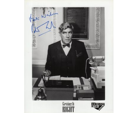 COOK PETER: (1937-1995) British Comedian. A scarce signed 8 x 10 photograph of Cook seated in a half length pose in costume a
