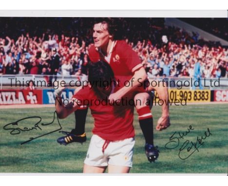 MAN UNITED      Autographed 12 x 8 col photo of Steve Coppell leaping upon team mate Stuart Pearson who had just scored the o