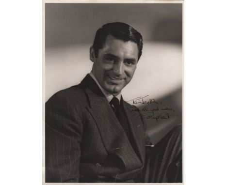 GRANT CARY: (1904-1986) British-born American Actor, Academy Award winner. A good vintage signed and inscribed 10 x 13 photog