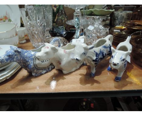 A selection of vintage ceramic cow creamers