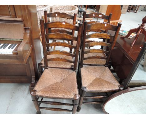 A set of four ladder back dinning chairs with rush seats