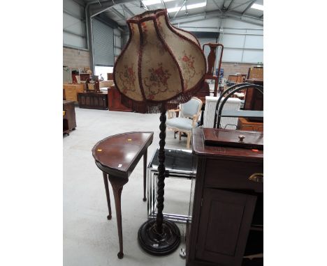 A traditional twist column standard lamp with vintage frame