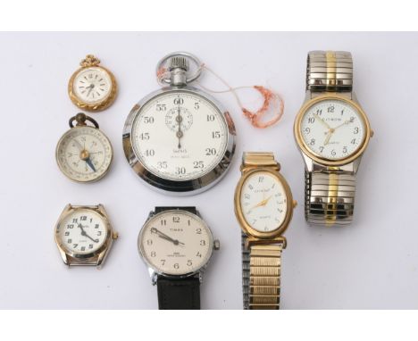 A collection of six watches including Timex and small compass