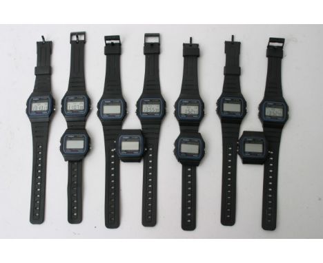 Collection of 11 digital Casio watches, seven with black straps and working