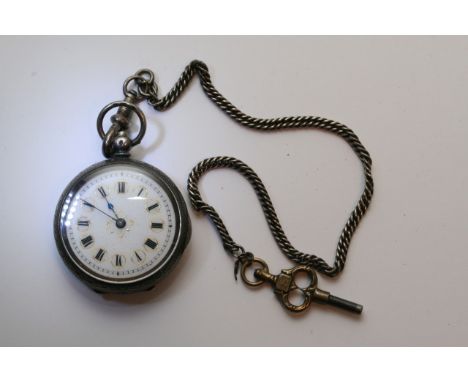 A silver cased key wind Swiss pocket watch with decorative enamel dial and attached chain.