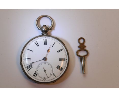 A silver key wind pocket watch with an enamel dial and subsidiary seconds dial.