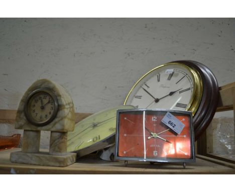 Two wall clocks, a mantel clock and a stone ware mantel clock