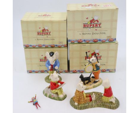 Four boxed Royal Doulton Rupert the Bear figurines, largest H: 13cm, no cracks or chips. UK P&amp;P Group 3 (£30+VAT for the 