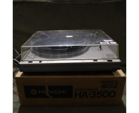 Hitachi HT-354 turntable with two speakers. All electrical items in this lot have been PAT tested for safety and have passed.