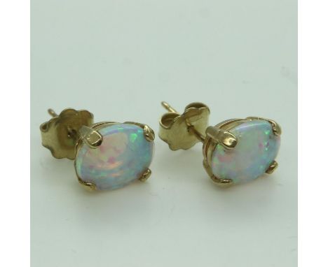 Presumed 9ct gold mounted pair of opal stud earrings. UK P&amp;P Group 0 (£6+VAT for the first lot and £1+VAT for subsequent 