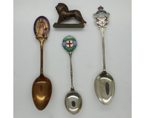 1924 British Empire Exhibition (Wembley): three enamelled souvenir teaspoons, and a cast lead Wembley Lion by Kew &amp; Co Lo