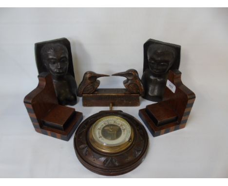 2 Pairs of carved wooden bookends, circular barometer and wooden container 