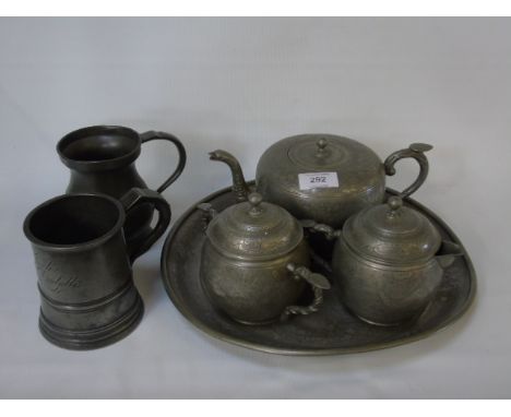 A 4 Piece oriental pewter tea service plus 2 antique pewter tankards