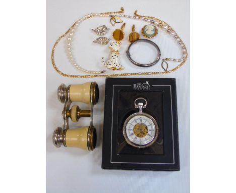 A pair of vintage opera glasses, some costume jewellery including a silver bangle