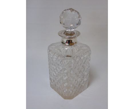 A square crystal decanter with a silver collar date marked Birmingham 1983