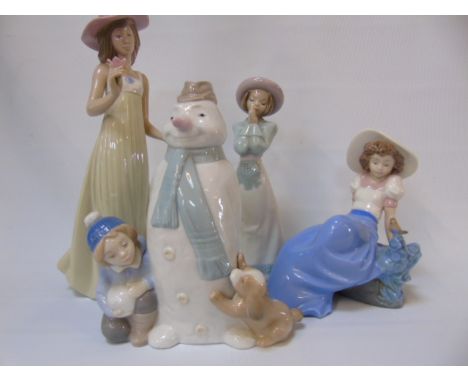 4 Nao figures 3 lady figures and a snowman, child and dog figure
