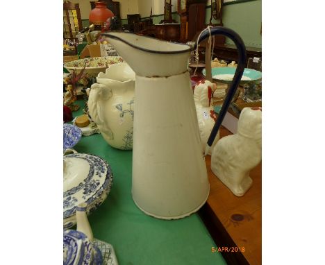 Tall white and blue handled enamel water jug