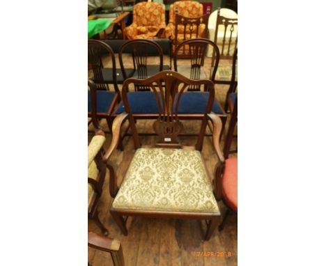 Rosewood framed armchair with five shaped vertical splats to back the padded seats upholstered in patterned light green and b