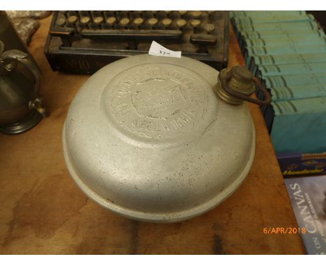 Early Smith Premier manual typewriter and a 'Adaptal' hot water bottle bed warmer