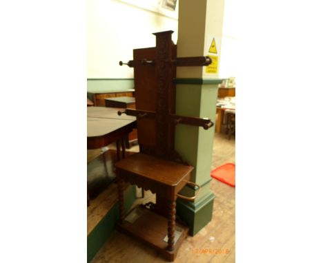 19th century carved oak hall stand fitted eight clothes hooks, single drawer and two compartment umbrella/stick storage areas