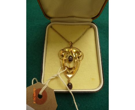 Art nouveau pendant set with garnets and the chain marked 9ct