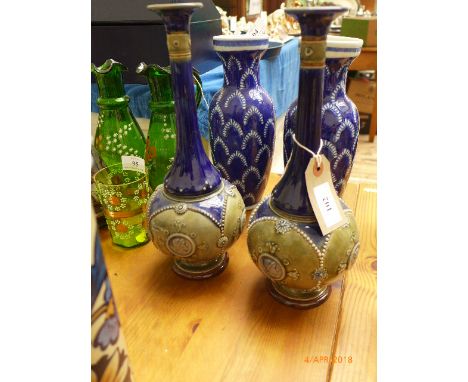 Most decorative pair of long stemmed Doulton Lambeth cobalt blue and green ground mantelpiece vases