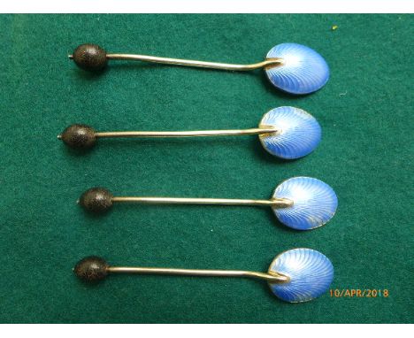 Four silver and blue enamel bead handled shell based coffee spoons (Birmingham 1926) and a pair of silver napkin rings (Birmi