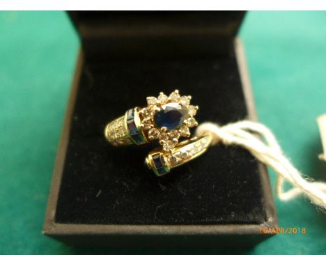 Sapphire and diamond crossover ring marked .750 (Size R)