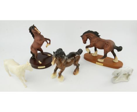 Three Beswick horses, 23cm high, a Sylvac dog, a Royal Doulton rearing horse, four wooden elephants, two Lurpack egg cups and