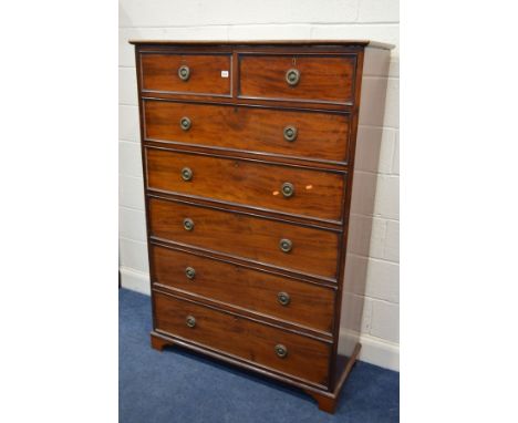 A TALL EARLY 20TH CENTURY MAHOGANY CHEST OF TWO SHORT OVER FIVE LONG DRAWERS, with brassed circular drop handles, on bracket 