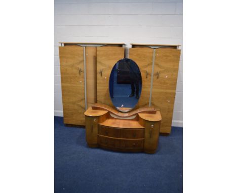 AN ART DECO WALNUT THREE PIECE BEDROOM SUITE, comprising of two sized double door wardrobes and a dressing table (sd)