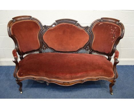 A VICTORIAN ROSEWOOD TRIPPLE BACK SOFA, with open armrests, on cabriole front legs and brass casters, width 166cm x depth 73c