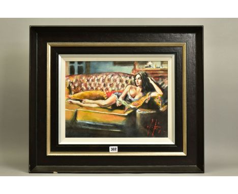 FABIAN PEREZ (ARGENTINA 1967) 'SABA WITH LETTER V' a scantily clad female figure relaxing on a leather sofa, signed bottom ri