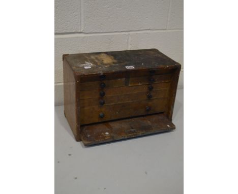 A VINTAGE ENGINEERS CHEST, the removable door enclosing various drawers, stamped M &amp; W, width 43cm x depth 22cm x height 