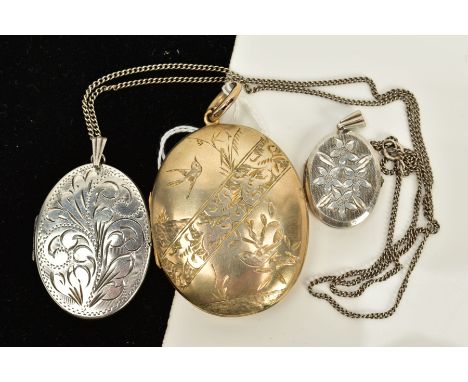 A LOCKET PENDANT NECKLACE AND TWO LOCKETS, the first a silver foliate engraved oval locket, hallmarked, Birmingham, suspended