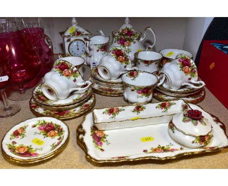 A ROYAL ALBERT OLD COUNTRY ROSES TEA SET, CLOCK, TRINKET BOX, ETC, including a tea pot, milk jug, sugar bowl, (chip to rim), 