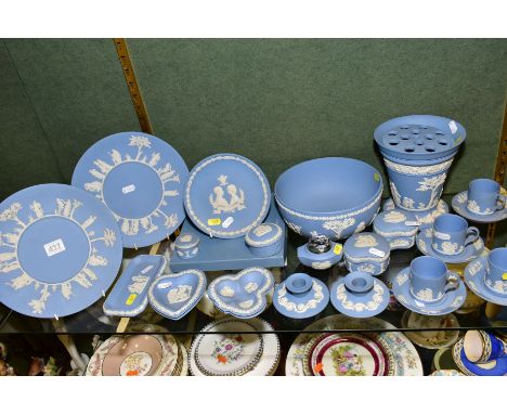 A GROUP OF WEDGWOOD PALE BLUE JASPERWARE, including cabinet plates, four coffee cans and saucers, a pair of dwarf candlestick