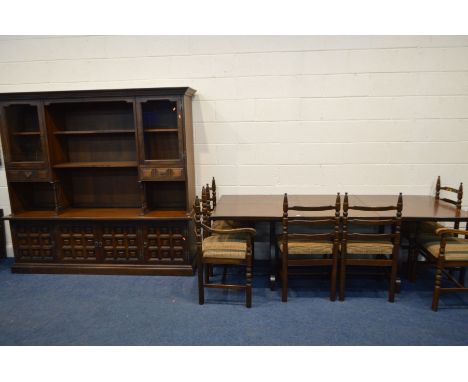 A YOUNGER OAK DINING SUITE, comprising an extending dining table with one additional leaf, extended length 219cm x closed len