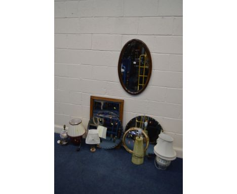 AN OAK OVAL WALL MIRROR, a golden oak framed wall mirror, three various other circular wall mirrors, together with five vario