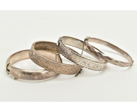 FOUR SILVER BANGLES, the first hinged bangle of a foliate engraved design, rope twist edge with additional safety chain, hall