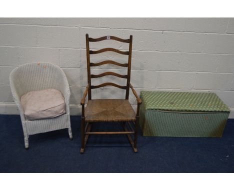 AN OAK RUSH SEATED LADDER BACK ROCKING CHAIR, together with a Lloyd loom wicker bedroom chair and a wicker ottoman (3)