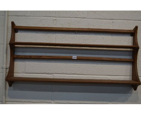 AN ERCOL GOLDEN DAWN HANGING PLATE RACK