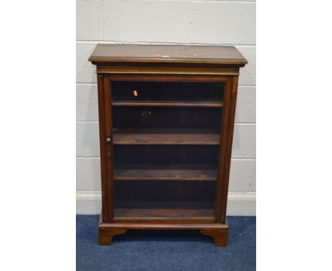 A GEORGIAN MAHOGANY GLAZED SINGLE DOOR BOOKCASE, on bracket feet, width 74.5cm x depth 33cm x height 106cm (key)