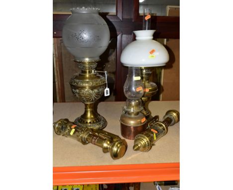 FIVE VARIOUS BRASS AND COPPER LAMPS, including a pair of reproduction GWR interior carriage lamps, a late Victorian oil lamp 