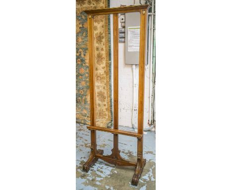 GALLERY EASEL, late 19th century French, mahogany with channelled frame on scroll supports and castors, 197cm H x 77cm x 46cm
