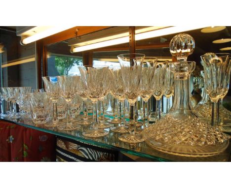 WATERFORD GLASSES, including champagne, red and white wines, port and brandy tumblers, plus a ships' style decanter. (38)