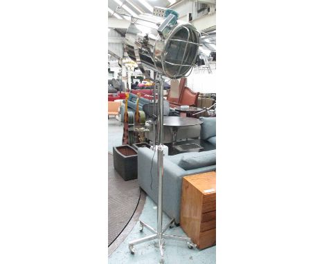 INDUSTRIAL STYLE STUDIO LAMP, polished metal on castors, 207cm H.