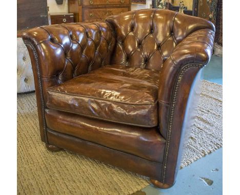CLUB ARMCHAIRS, a pair, club style, deep button, hand finished leaf brown leather each with a cushion, 93cm W x 87cm D. (2)